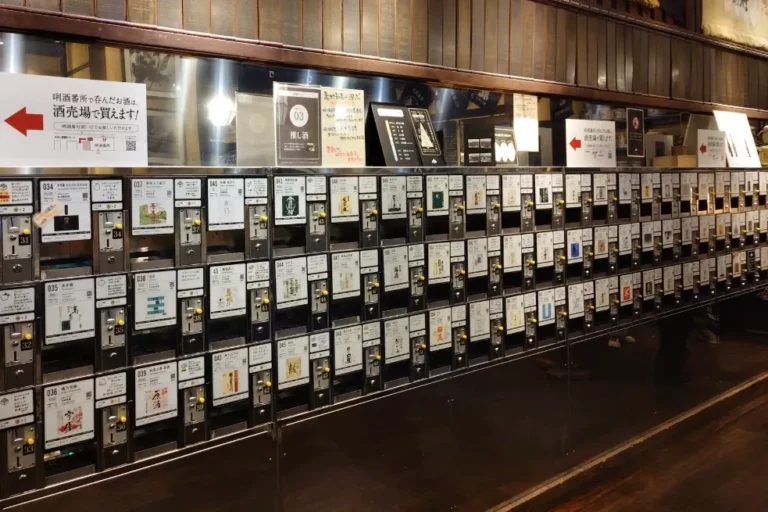 Rows of labelled sake tasting dispensers at Ponshukan Echigo-Yuzawa.