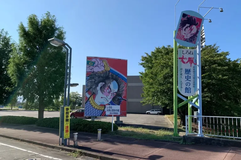 A large warrior kite illustration at the entrance to Shirone Giant Kite and History Museum.