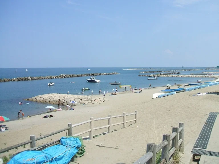 A broad sandy shore and small boats along Sekiya Beach on the Sea of Japan in Niigata City.